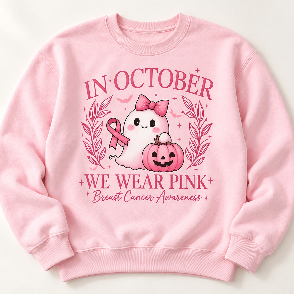 Pink ribbon ghost and pumpkin on a light pink crewneck sweatshirt